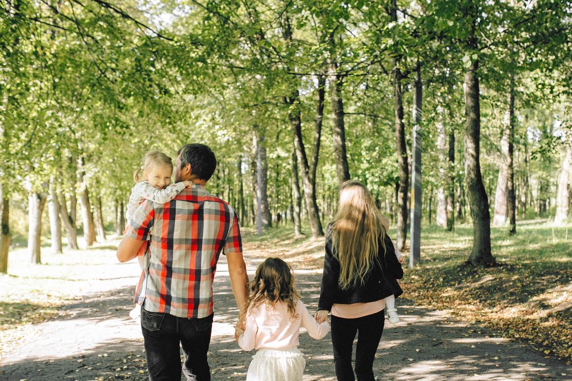 Illustrative stock photograph of a family walking together
